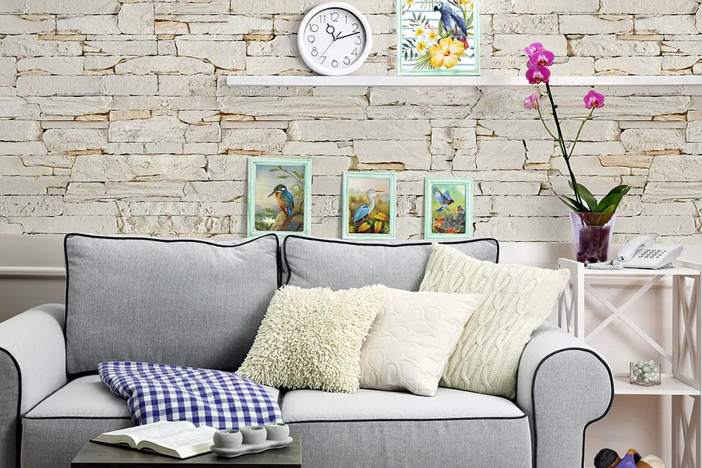 Light cream stone feature wall behind a sofa