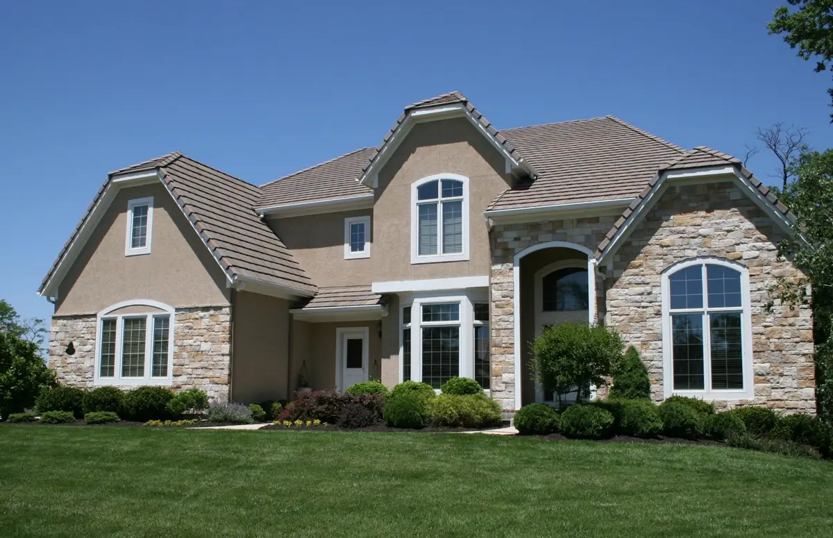 Home exterior combining Castle stone veneer in Ozark Mountain with stucco