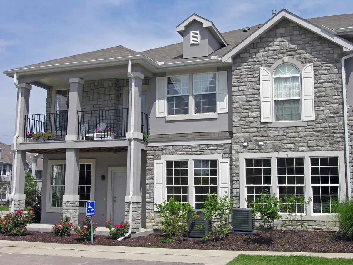 Row of townhouses clad in Classic Cut stone veneer in Morning Mist