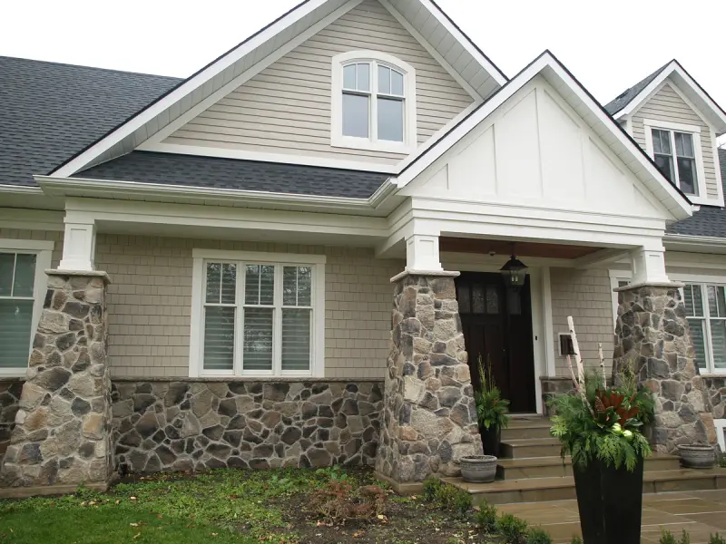 Fieldstone veneer set in mortar on a house exterior