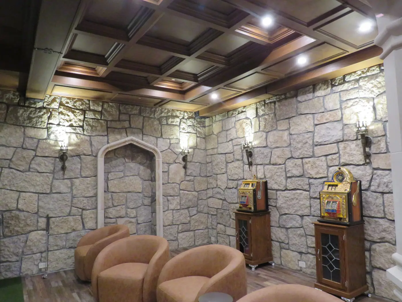 Stone-walled lounge with a coffered timber ceiling