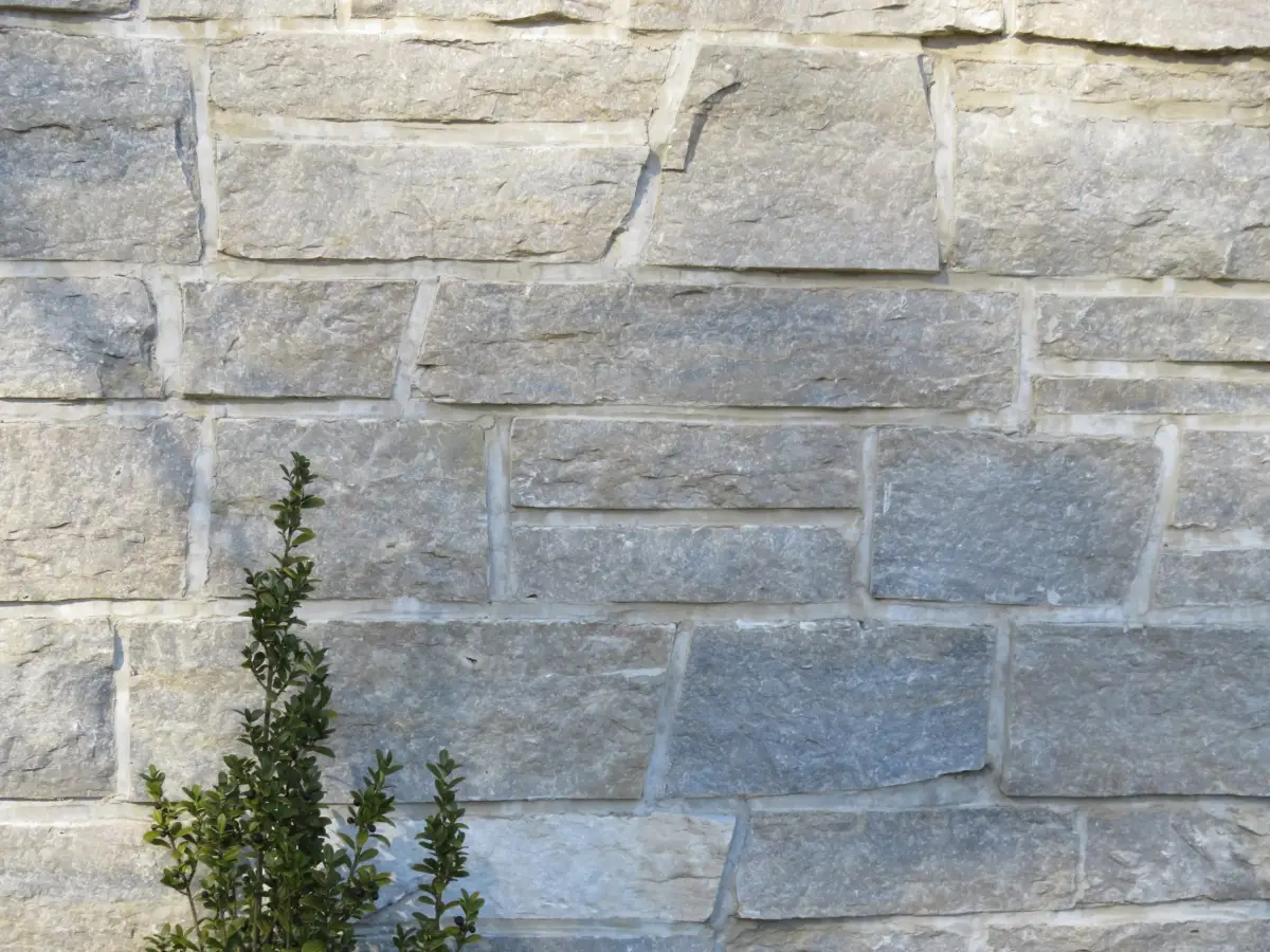 Close detail of coursed squared limestone