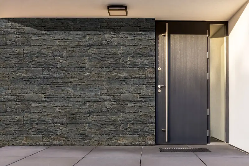 House exterior clad in Alverstone natural stone in Lava